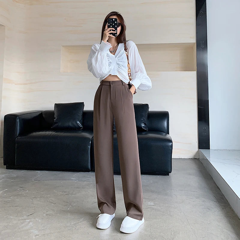 Calça feminina de cintura alta até o chão, reta e comprida